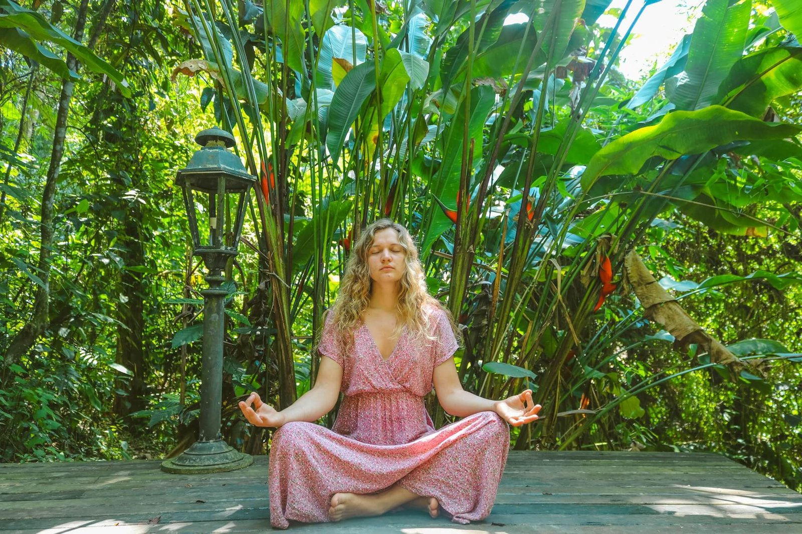 a woman meditating in nature